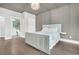 Bedroom with hardwood floors, light blue walls, coffered ceiling, and connecting bathroom at 467 Hidden Meadow Ln, Summerville, SC 29486