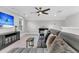 Spacious bonus room with cozy seating, a ceiling fan, and a large television for entertainment at 467 Hidden Meadow Ln, Summerville, SC 29486