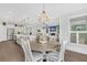 Open floorplan featuring a dining area, kitchen island, and view into the living room at 467 Hidden Meadow Ln, Summerville, SC 29486
