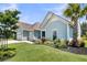 Charming home featuring a well-maintained lawn, mature trees, and landscaping, illuminated by soft outdoor lighting at 467 Hidden Meadow Ln, Summerville, SC 29486