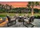 Inviting backyard patio featuring a cozy fire pit and comfortable seating area with landscaping at 467 Hidden Meadow Ln, Summerville, SC 29486