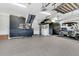 Well-organized garage with custom cabinets, tool storage, and an electric golf cart at 467 Hidden Meadow Ln, Summerville, SC 29486