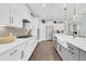 Well-lit kitchen featuring white cabinets, stainless steel appliances, and a center island with seating at 467 Hidden Meadow Ln, Summerville, SC 29486