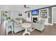 Bright living room with a cozy fireplace, built-in shelving, and comfortable seating at 467 Hidden Meadow Ln, Summerville, SC 29486