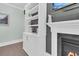 Custom built-in shelving creates a striking accent next to a modern fireplace at 467 Hidden Meadow Ln, Summerville, SC 29486
