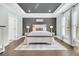 Spacious bedroom features a tray ceiling, wainscoting and large windows with lots of natural light at 467 Hidden Meadow Ln, Summerville, SC 29486