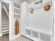 Organized mudroom featuring custom cabinets, storage cubbies, and stylish patterned tile flooring at 467 Hidden Meadow Ln, Summerville, SC 29486
