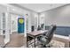 Comfortable home office with wainscoting, a modern desk, and an inviting view of the front door at 467 Hidden Meadow Ln, Summerville, SC 29486