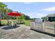 Outdoor patio featuring an umbrella-covered dining table and a built-in outdoor grill setup at 467 Hidden Meadow Ln, Summerville, SC 29486