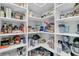 Organized walk-in pantry with shelves stocked with a variety of food items and small appliances at 467 Hidden Meadow Ln, Summerville, SC 29486
