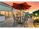Stylish outdoor patio with dining and seating areas, enhanced by warm lighting and landscaping at 467 Hidden Meadow Ln, Summerville, SC 29486