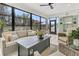 Spacious sunroom features a large seating area and views of the well-maintained backyard at 467 Hidden Meadow Ln, Summerville, SC 29486