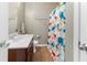 A bathroom featuring a vanity with sink, toilet, and a shower with a colorful dinosaur-themed curtain at 4801 Shady Tree Ln, Summerville, SC 29485