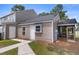 Rear exterior of a home with a door and window that leads to the yard at 4801 Shady Tree Ln, Summerville, SC 29485