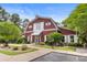 Charming community clubhouse with unique barn-style architecture, professional landscaping, and inviting entrance at 4801 Shady Tree Ln, Summerville, SC 29485