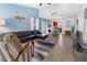 Spacious living room with a large sectional sofa, accent chair, and tile floors at 4801 Shady Tree Ln, Summerville, SC 29485