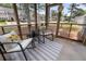 Relaxing screened-in porch with cozy seating, perfect for enjoying the outdoors at 4801 Shady Tree Ln, Summerville, SC 29485