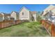 Spacious backyard with a lush green lawn and wooden fence at 4936 Ballantine Dr, Summerville, SC 29485