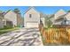 Backyard with a long driveway leading to the garage, and lawn area at 4936 Ballantine Dr, Summerville, SC 29485