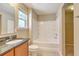 Bright bathroom with tub, shower, and granite vanity at 4936 Ballantine Dr, Summerville, SC 29485