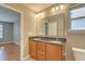 Bathroom featuring double sinks, large mirror, and wood cabinets at 4936 Ballantine Dr, Summerville, SC 29485
