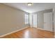 Bedroom showcasing neutral walls, wooden floors, and natural light at 4936 Ballantine Dr, Summerville, SC 29485