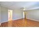 Spacious bedroom with hardwood floors, ceiling fan, and access to a bathroom at 4936 Ballantine Dr, Summerville, SC 29485