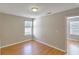 Bedroom with hardwood floors and view of the neighborhood at 4936 Ballantine Dr, Summerville, SC 29485