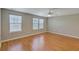 Bedroom with hardwood floors, two large windows and ceiling fan at 4936 Ballantine Dr, Summerville, SC 29485