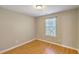 Cozy bedroom with wooden floors and a large window at 4936 Ballantine Dr, Summerville, SC 29485