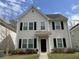 Charming two-story home with landscaped yard and classic architectural details at 4936 Ballantine Dr, Summerville, SC 29485