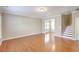 Spacious living room with hardwood floors, white trim, and stairway at 4936 Ballantine Dr, Summerville, SC 29485