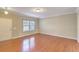 View of living room with hardwood floors and adjacent entryway at 4936 Ballantine Dr, Summerville, SC 29485