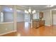 Living room with hardwood floors, open to kitchen at 4936 Ballantine Dr, Summerville, SC 29485