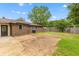 Expansive backyard featuring a well-maintained lawn, mature trees, and a brick home at 4965 Foxwood Dr, North Charleston, SC 29418