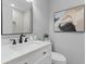 Well-lit bathroom featuring a modern vanity, stylish mirror, and elegant decorative accents at 4965 Foxwood Dr, North Charleston, SC 29418