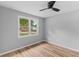 Bright bedroom showcasing wood floors, ceiling fan and a window at 4965 Foxwood Dr, North Charleston, SC 29418