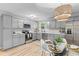 Modern kitchen featuring stainless steel appliances, gray cabinetry, and a breakfast nook at 4965 Foxwood Dr, North Charleston, SC 29418