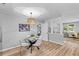 Bright kitchen featuring stainless appliances and eat-in dining area with modern lighting at 4965 Foxwood Dr, North Charleston, SC 29418