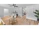 Open living room with hardwood floors connecting to a modern, updated kitchen area at 4965 Foxwood Dr, North Charleston, SC 29418