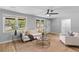 Bright living room offering comfortable seating, a ceiling fan, and sun-filled windows at 4965 Foxwood Dr, North Charleston, SC 29418