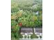 Aerial view of townhome, showing the treed neighborhood, parking, and building layout at 5001 Hay Bale Ct, Summerville, SC 29485