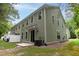 View of the back exterior of the home showcasing the sliding glass doors, patio, and air conditioning unit at 5001 Hay Bale Ct, Summerville, SC 29485