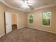 Spacious bedroom with large windows and plush carpeting and ceiling fan at 5001 Hay Bale Ct, Summerville, SC 29485