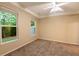 Bedroom featuring plush carpeting, neutral walls, and large windows offering lots of natural light at 5001 Hay Bale Ct, Summerville, SC 29485