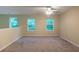 Bedroom featuring plush carpeting, neutral walls, and two large windows offering lots of natural light at 5001 Hay Bale Ct, Summerville, SC 29485
