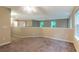 Spacious bonus room features carpet, large windows and neutral tones providing an open airy feel at 5001 Hay Bale Ct, Summerville, SC 29485