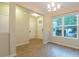 Open-concept dining space with hardwood floors, lots of natural light, and a clean, minimalist design at 5001 Hay Bale Ct, Summerville, SC 29485