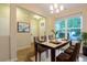 Elegant dining room with ample natural light, a stylish table, and contemporary decor perfect for Gathering meals and gatherings at 5001 Hay Bale Ct, Summerville, SC 29485