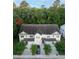 Charming townhome with a well-maintained exterior, attached garages, and lush trees at 5001 Hay Bale Ct, Summerville, SC 29485